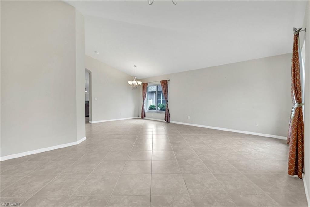 15645 Beachcomber Avenue Fort Myers, FL 33908 - Photo 20 of 33 a view of an empty room with a window