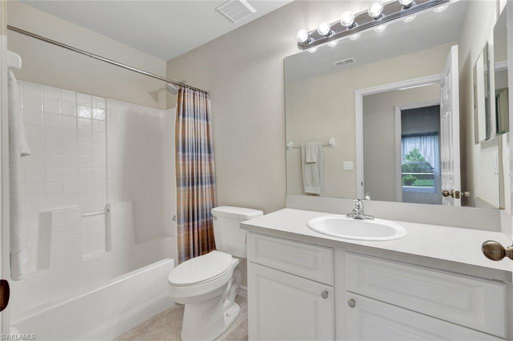 15645 Beachcomber Avenue Fort Myers, FL 33908 - Photo 24 of 33 a bathroom with a sink a toilet and shower