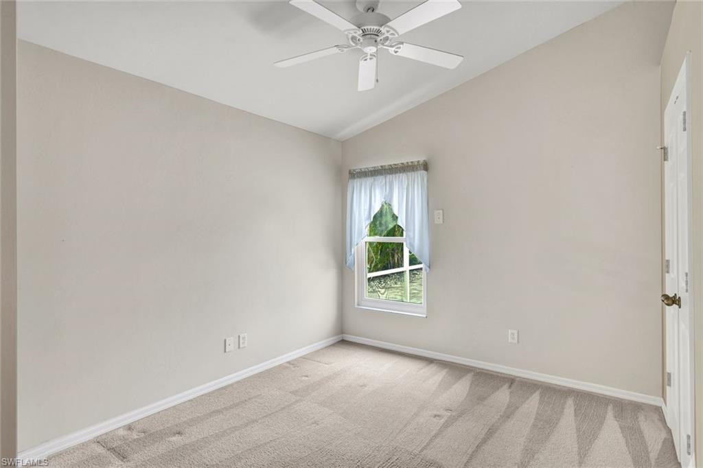 15645 Beachcomber Avenue Fort Myers, FL 33908 - Photo 25 of 33 an empty room with windows and fan