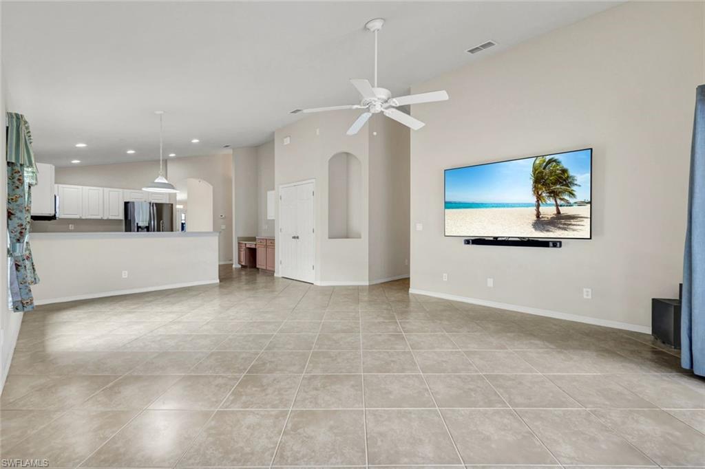 15645 Beachcomber Avenue Fort Myers, FL 33908 - Photo 4 of 33 a view of a kitchen with a sink and a stove top oven