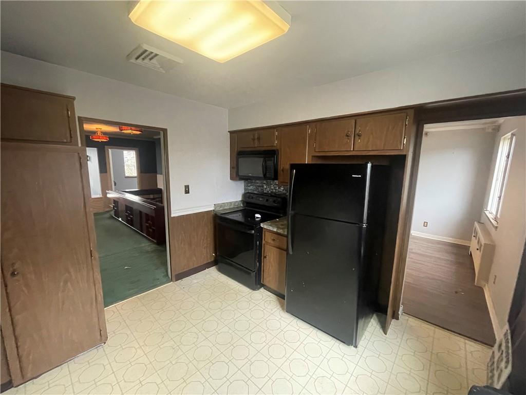 701 Thompson Avenue Donora, PA 15033 - Photo 12 of 36 a kitchen with a refrigerator and a sink