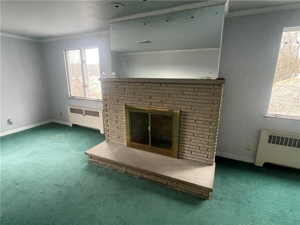 701 Thompson Avenue Donora, PA 15033 - Photo 16 of 36 an empty room with a fireplace and window
