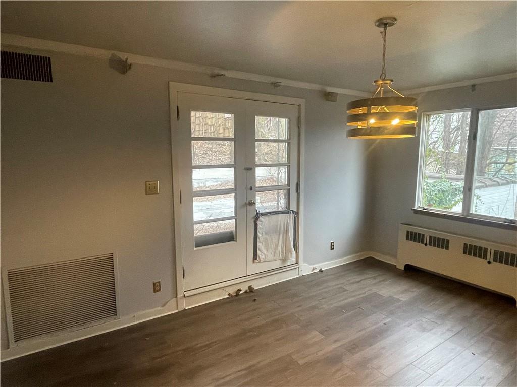 701 Thompson Avenue Donora, PA 15033 - Photo 17 of 36 an empty room with wooden floor and windows