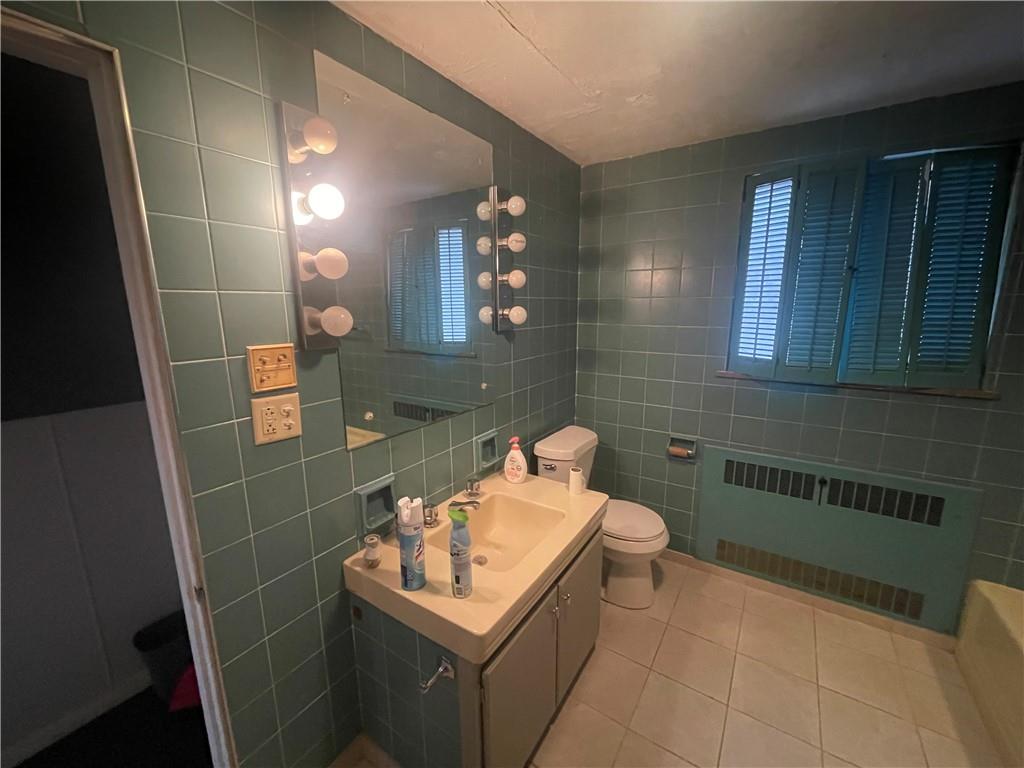 701 Thompson Avenue Donora, PA 15033 - Photo 21 of 36 a bathroom with a sink toilet and mirror