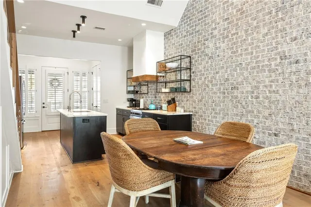 a outdoor dining space with furniture and a potted plant