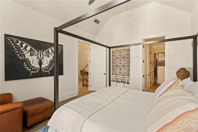 a bedroom with a bed and a couch