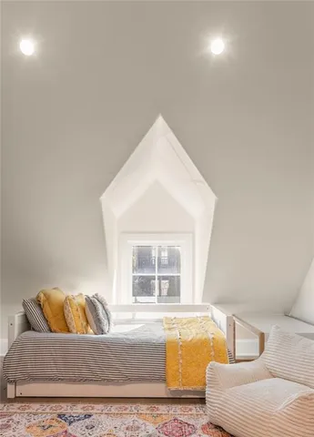 a living room with a couch and a window