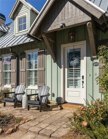 a front view of a house with outdoor seating