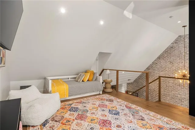 a bedroom with a bed and couch