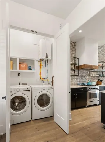 a view of a kitchen with washer and dryer