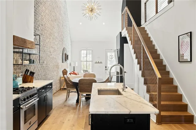 a view of a kitchen with furniture and staircase