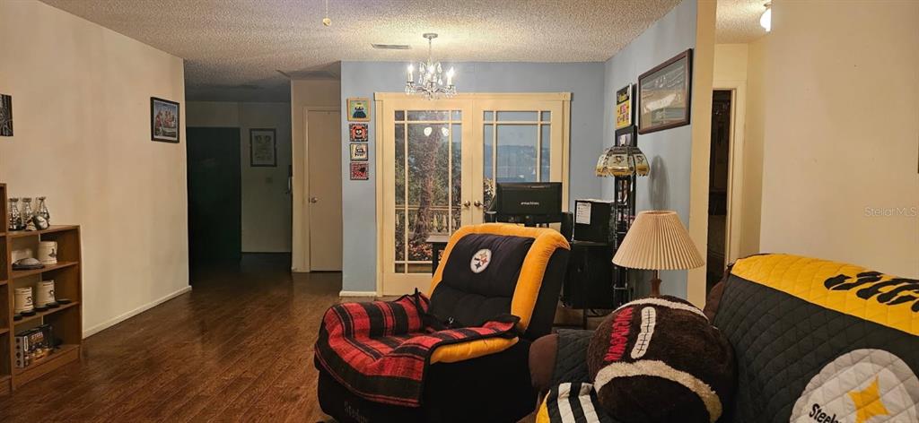 8666 Southwest 92nd Lane, Unit F Ocala, FL 34481 - Photo 5 of 12 a living room with furniture fireplace and a lamp