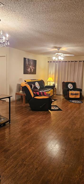 8666 Southwest 92nd Lane, Unit F Ocala, FL 34481 - Photo 6 of 12 a living room with furniture and a wooden floor