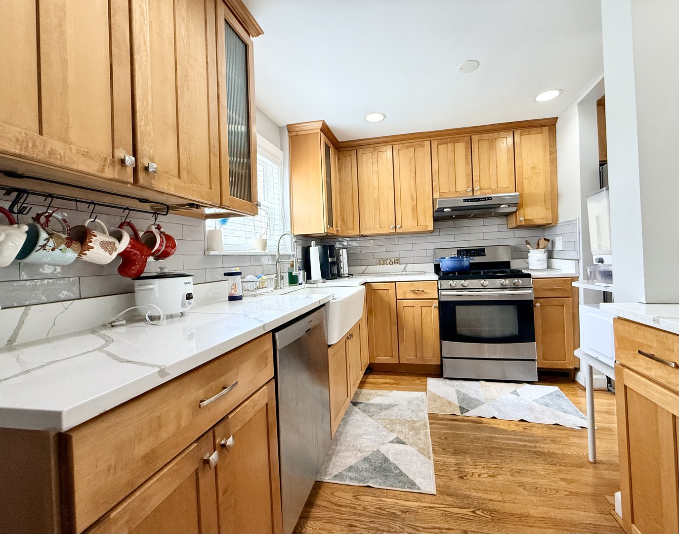 416 North Main Street Mount Prospect, IL 60056 - Photo 4 of 24 a kitchen with stainless steel appliances kitchen island granite countertop a sink dishwasher stove and cabinets