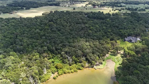 a view of lake with green space