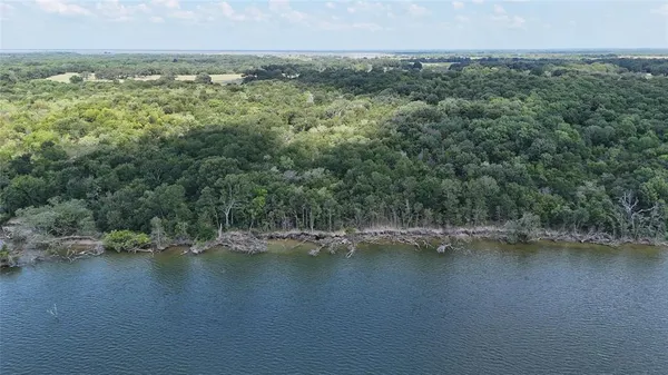 a view of lake with green space