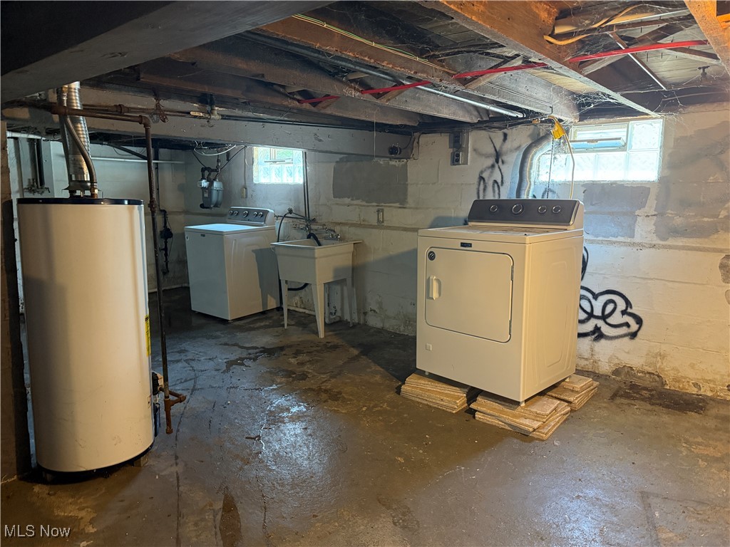 6350 Meadowbrook Road Garfield Heights, OH 44125 - Photo 28 of 28 Basement featuring gas water heater and washer and dryer