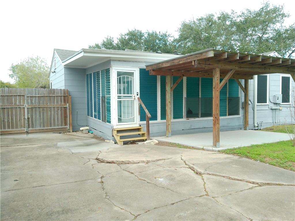 1017 Sorrell Street Corpus Christi, TX 78404 - Photo 14 of 16 a view of a house with a backyard and porch