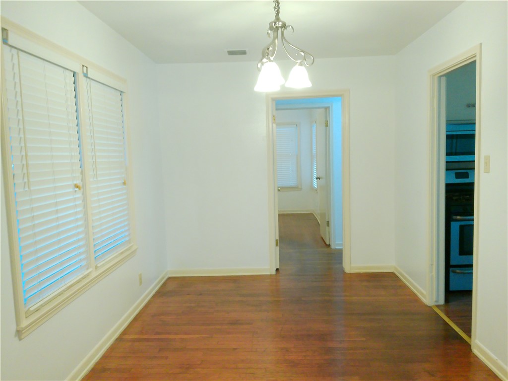 1017 Sorrell Street Corpus Christi, TX 78404 - Photo 4 of 16 a view of empty room with wooden floor and fan