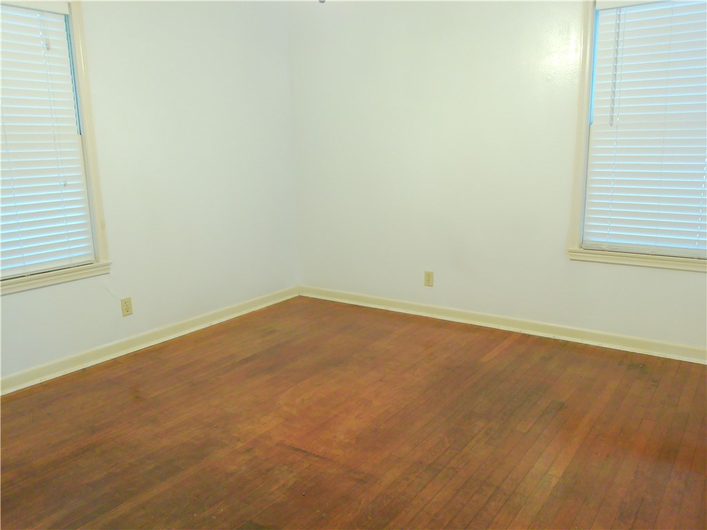 1017 Sorrell Street Corpus Christi, TX 78404 - Photo 8 of 16 an empty room with a window
