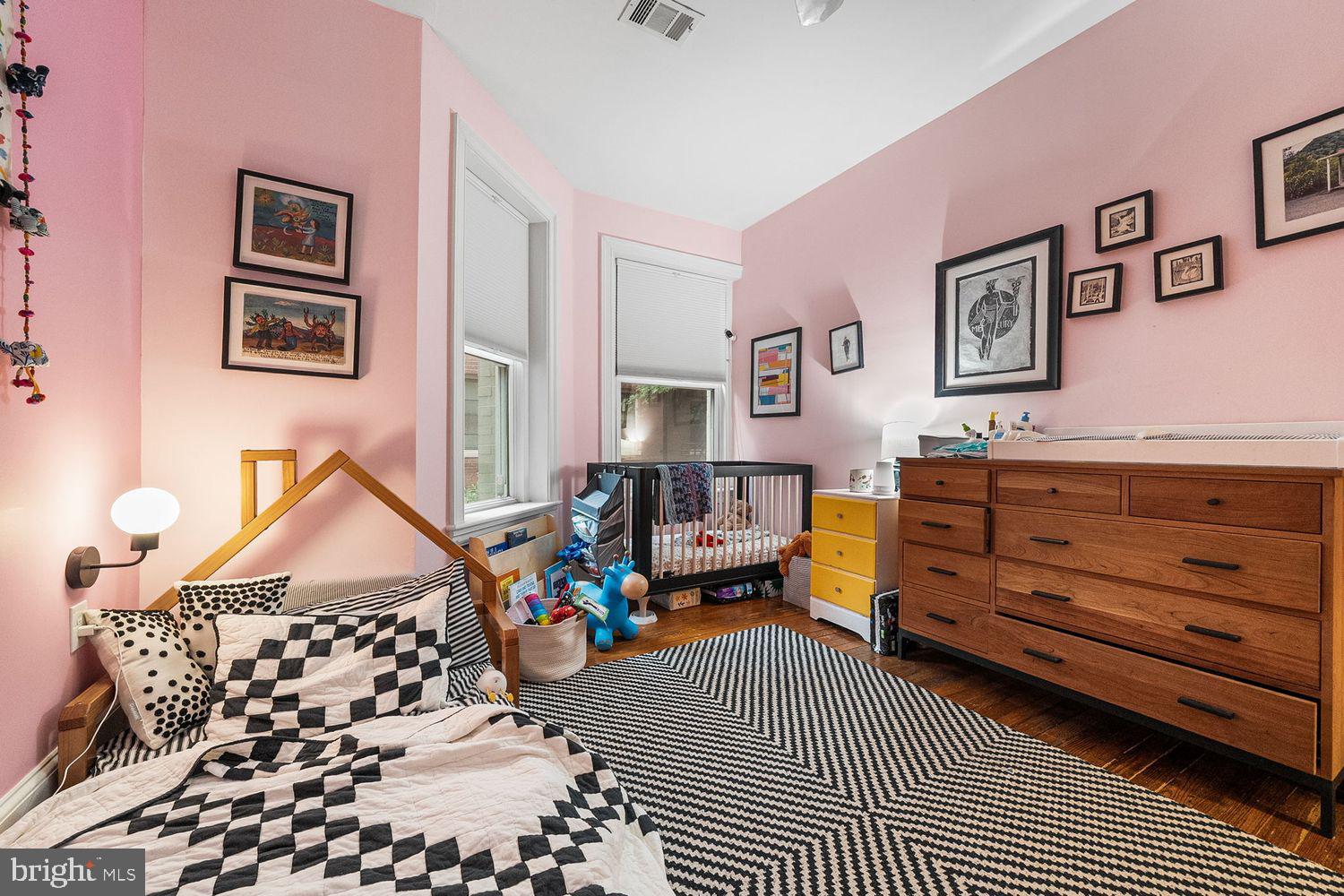 1423 R Street Northwest, Unit 105 Washington, DC 20009 - Photo 21 of 32 a bedroom with furniture and a window