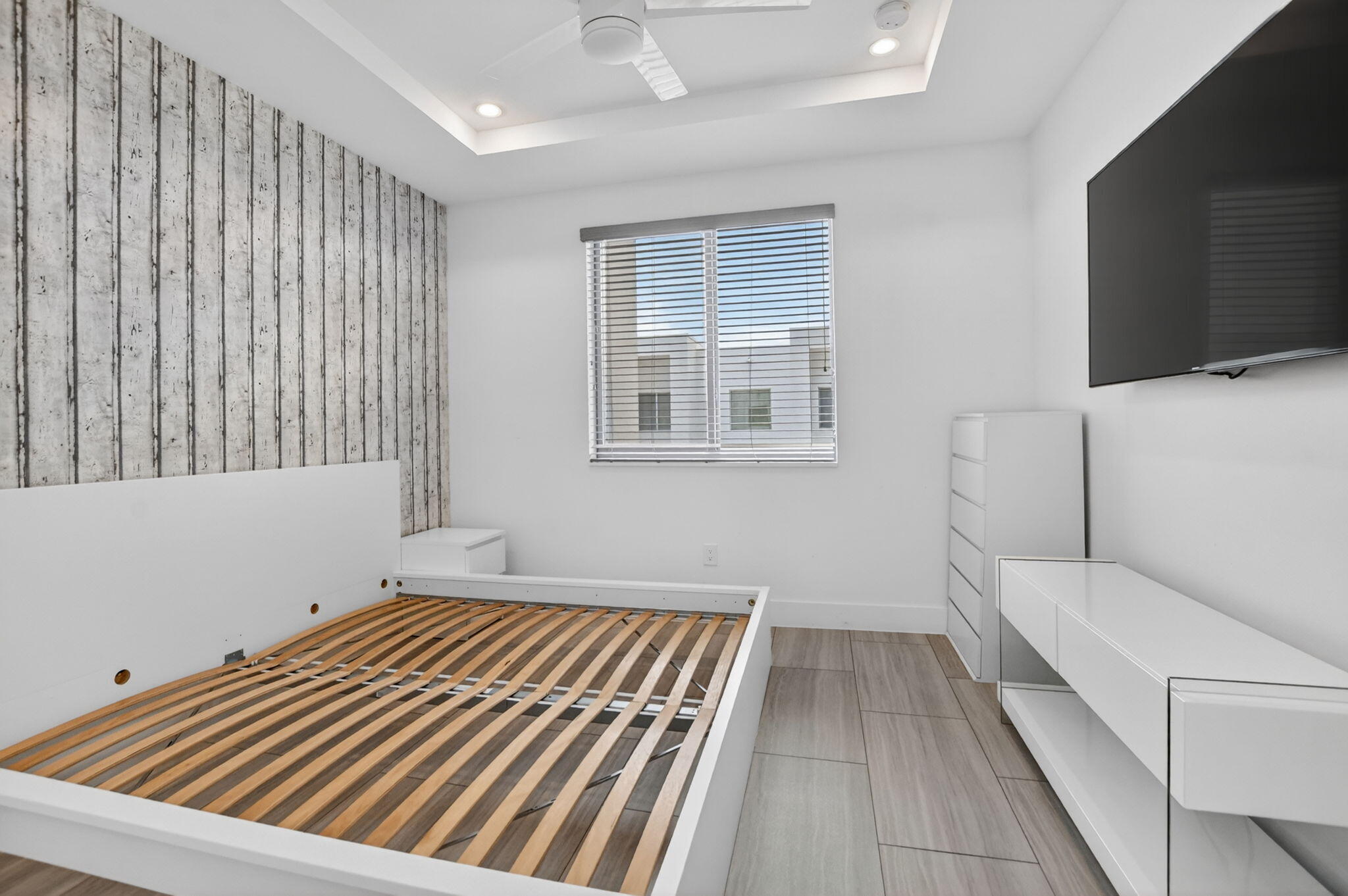 4021 Northwest 18th Way Boca Raton, FL 33431 - Photo 31 of 37 a bedroom with a bed and a couch