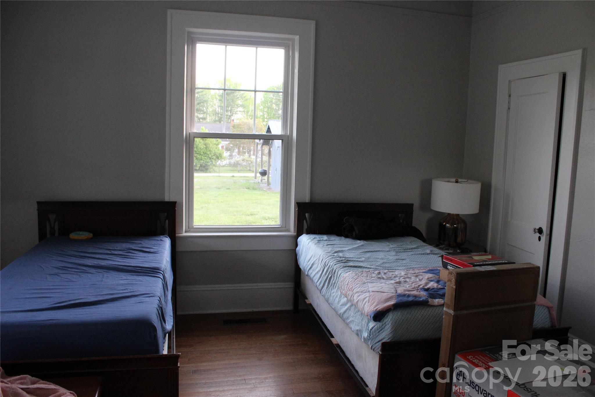 300 Banner Farm Road Mills River, NC 28759 - Photo 17 of 21 a bedroom with a bed and wooden floor