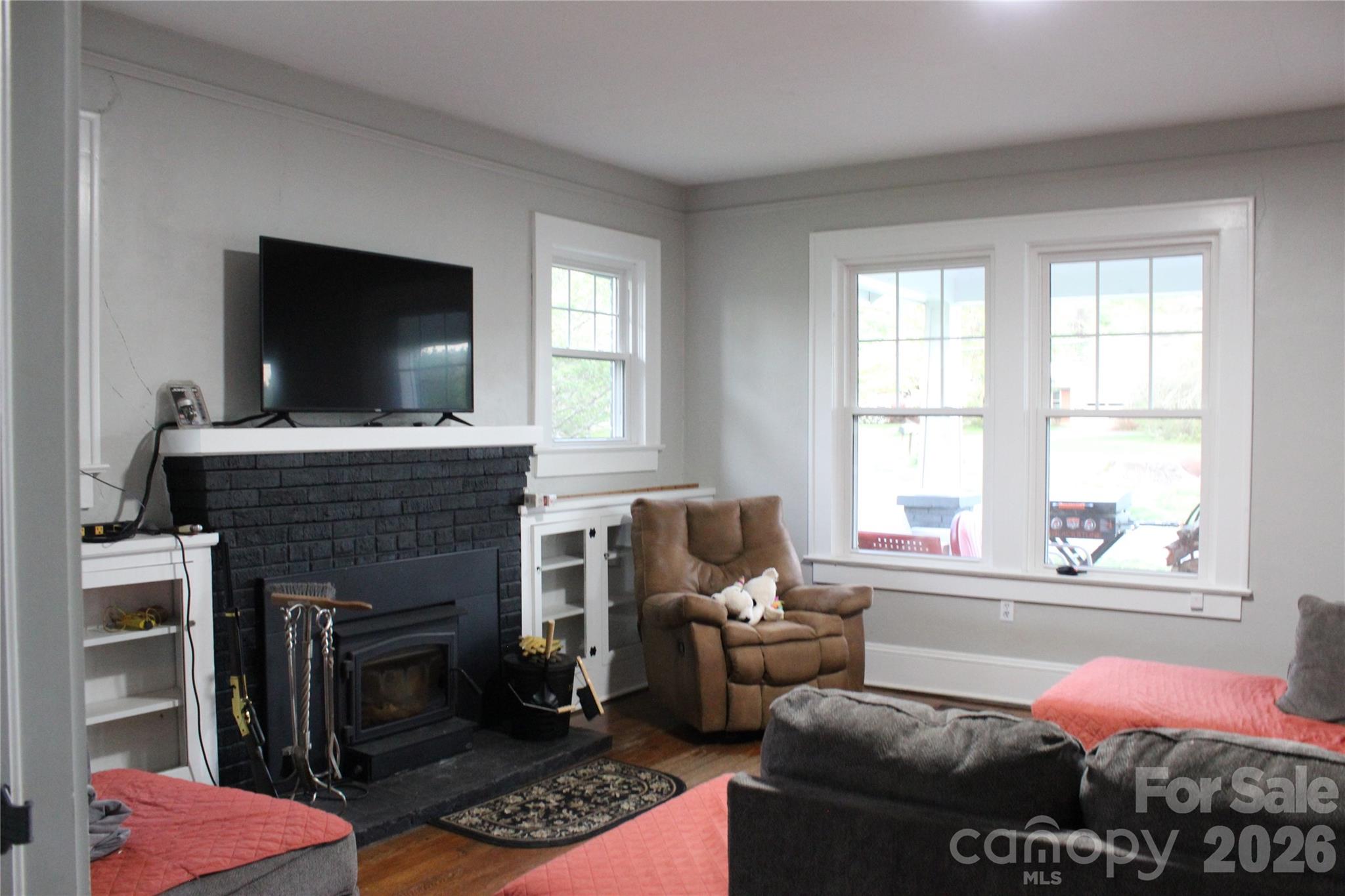 300 Banner Farm Road Mills River, NC 28759 - Photo 19 of 21 a living room with furniture and a fireplace
