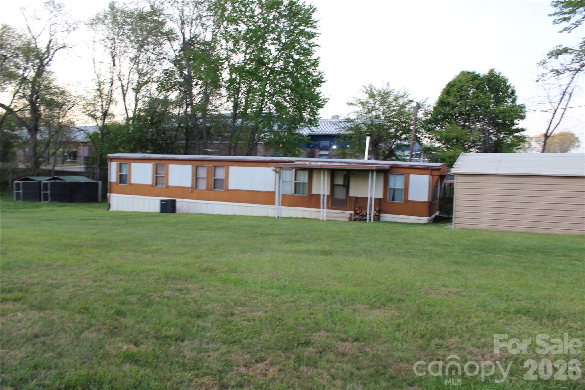 300 Banner Farm Road Mills River, NC 28759 - Photo 20 of 21 a view of a house with a backyard