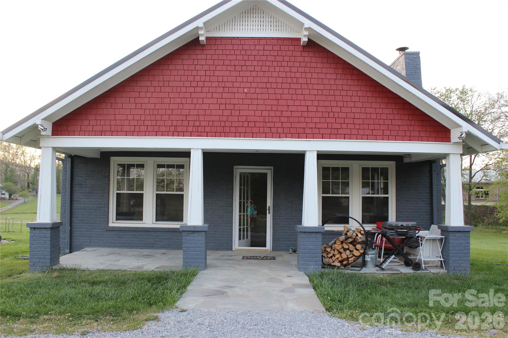 300 Banner Farm Road Mills River, NC 28759 - Photo 2 of 21 a front view of a house with a garden and porch