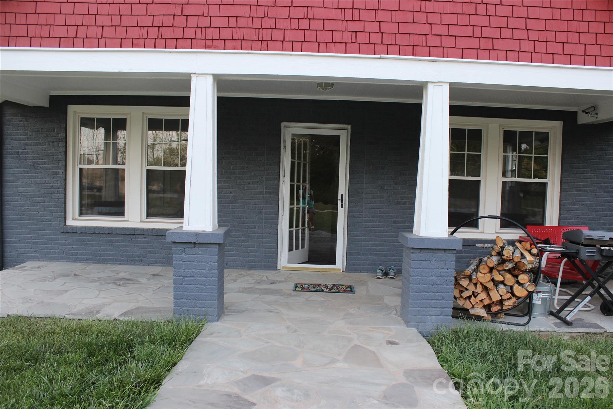 300 Banner Farm Road Mills River, NC 28759 - Photo 3 of 21 a front view of a house with porch and outdoor seating