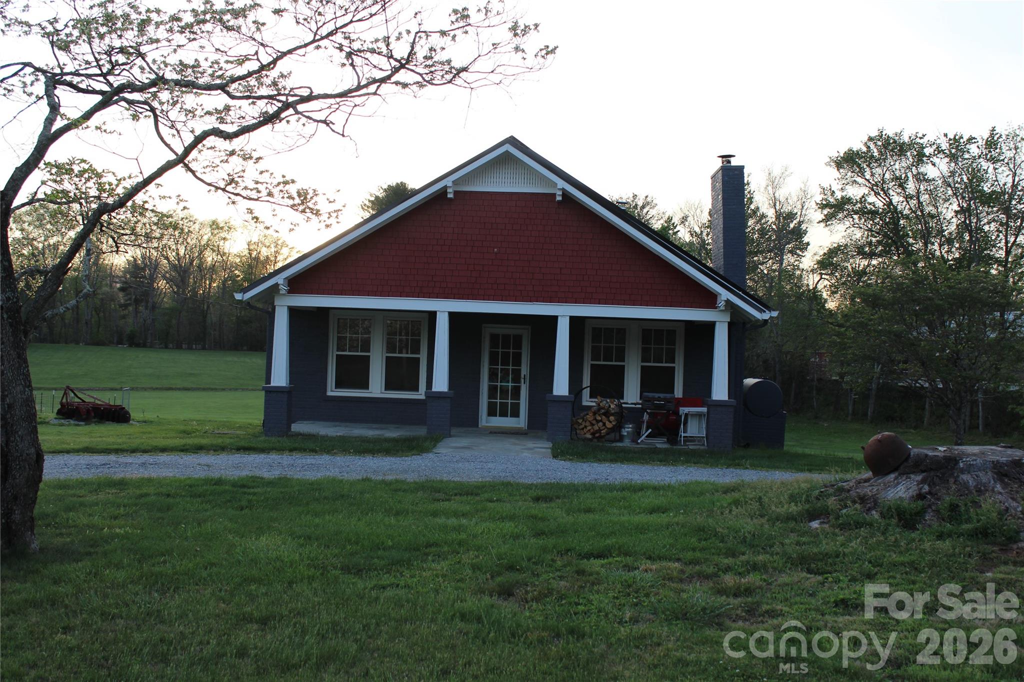 300 Banner Farm Road Mills River, NC 28759 - Photo 5 of 21 a front view of a house with a yard and porch
