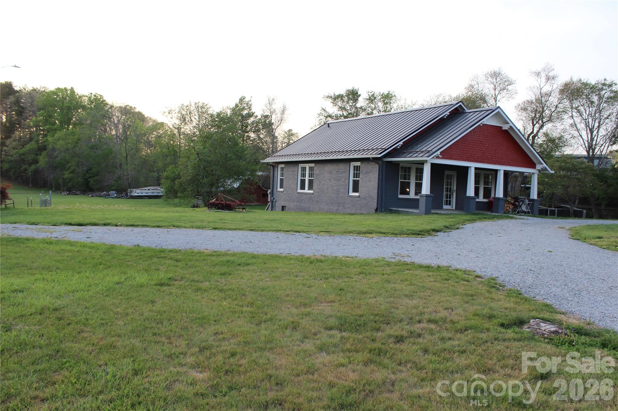 300 Banner Farm Road Mills River, NC 28759 - Photo 6 of 21 a front view of a house with a yard and trees