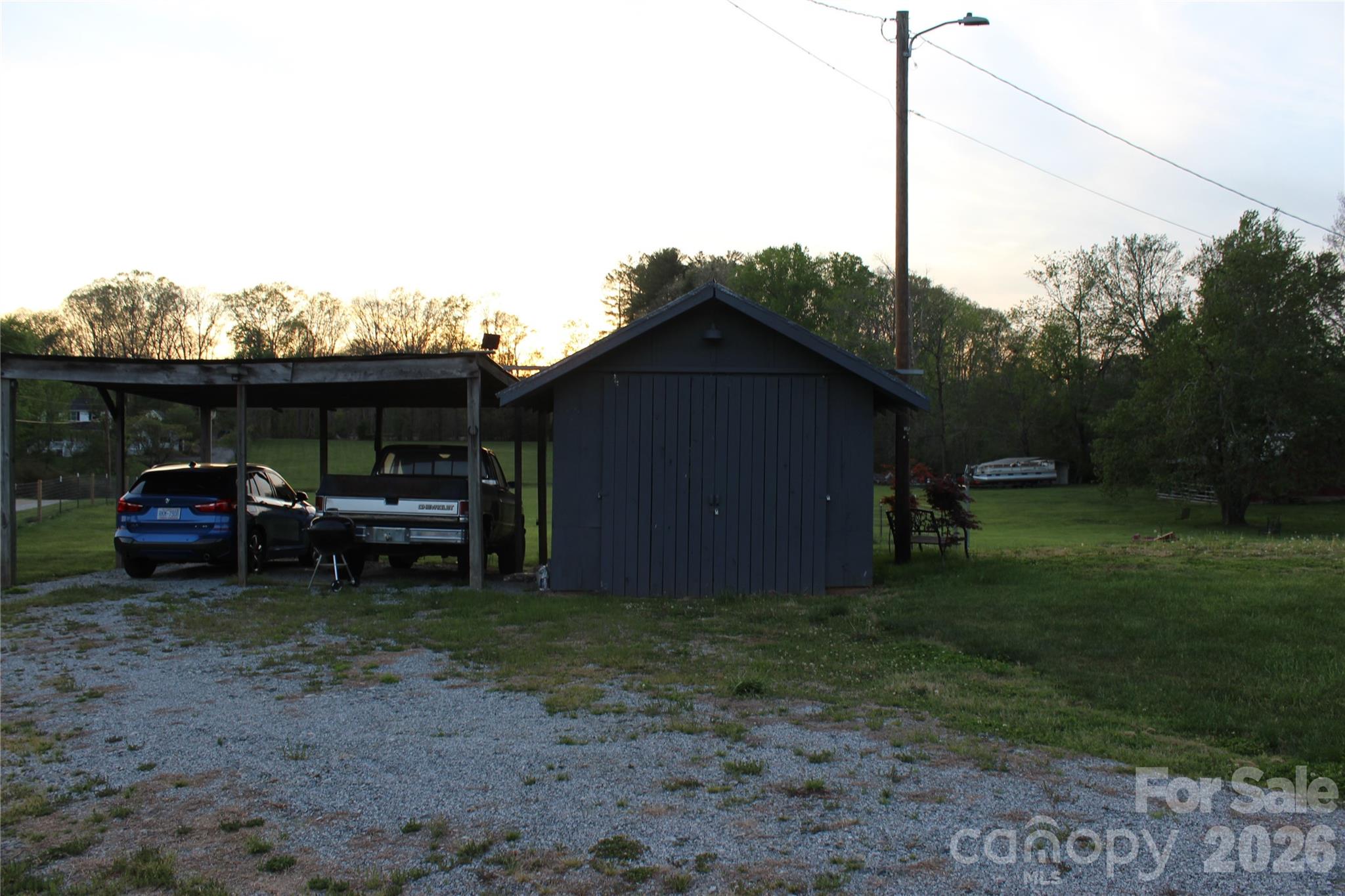 300 Banner Farm Road Mills River, NC 28759 - Photo 10 of 21 a view of a house with a backyard and furniture
