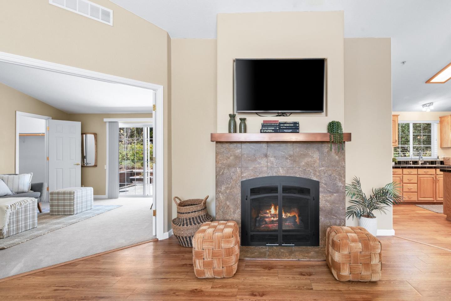 552 Bean Creek Road Scotts Valley, CA 95066 - Photo 18 of 76 a living room with a fireplace and a flat screen tv