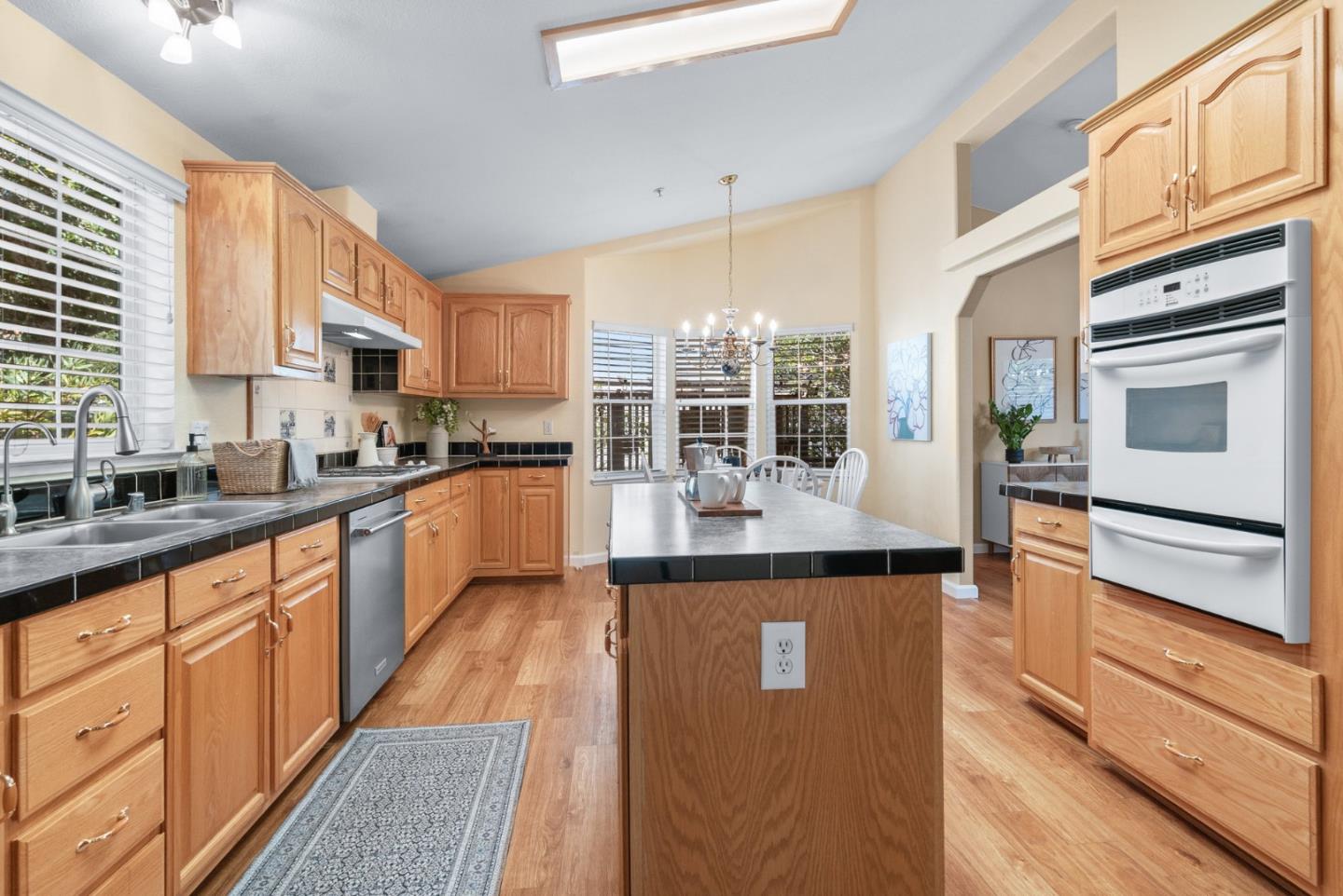 552 Bean Creek Road Scotts Valley, CA 95066 - Photo 29 of 76 a kitchen with stainless steel appliances granite countertop a refrigerator a stove and a sink with cabinets