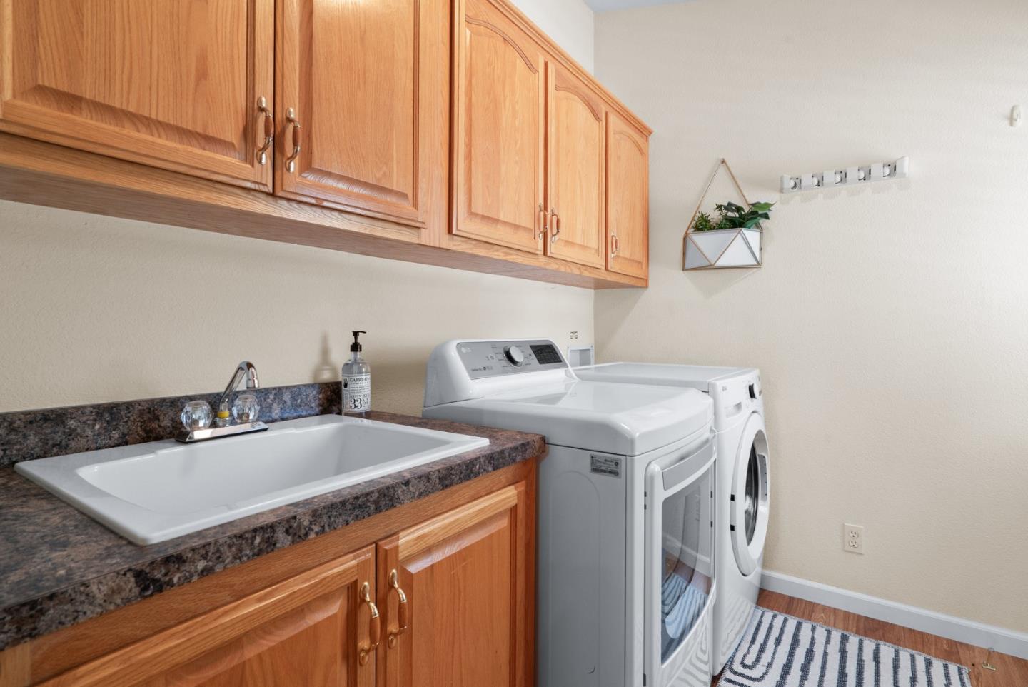 552 Bean Creek Road Scotts Valley, CA 95066 - Photo 46 of 76 a utility room with sink dryer and washer