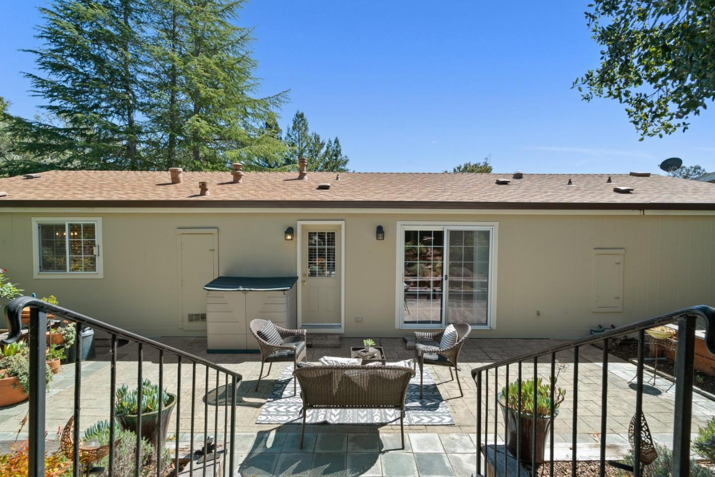 552 Bean Creek Road Scotts Valley, CA 95066 - Photo 64 of 76 a view of a patio with table and chairs with wooden floor and fence