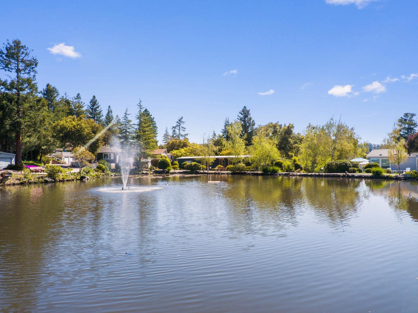 552 Bean Creek Road Scotts Valley, CA 95066 - Photo 69 of 76 a view of a ocean with boats and trees in the background