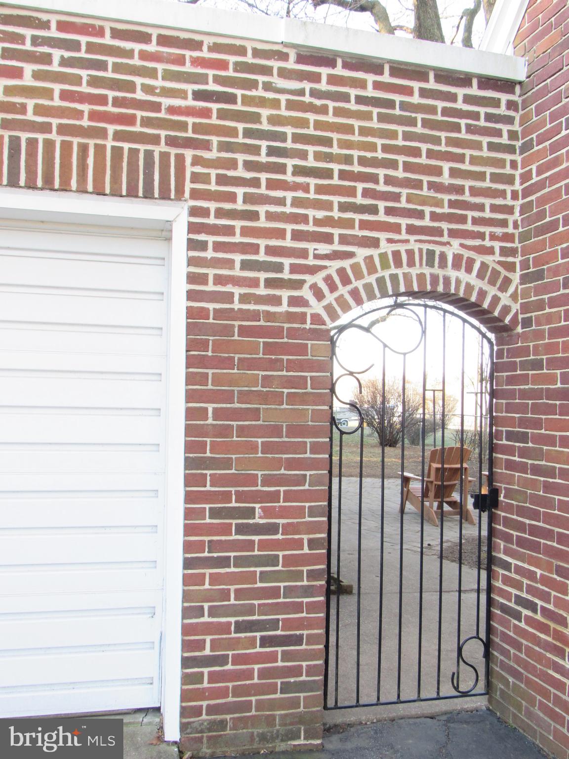 1116 Valley View Road York, PA 17403 - Photo 23 of 27 Brick arch and Iron gate to back yard