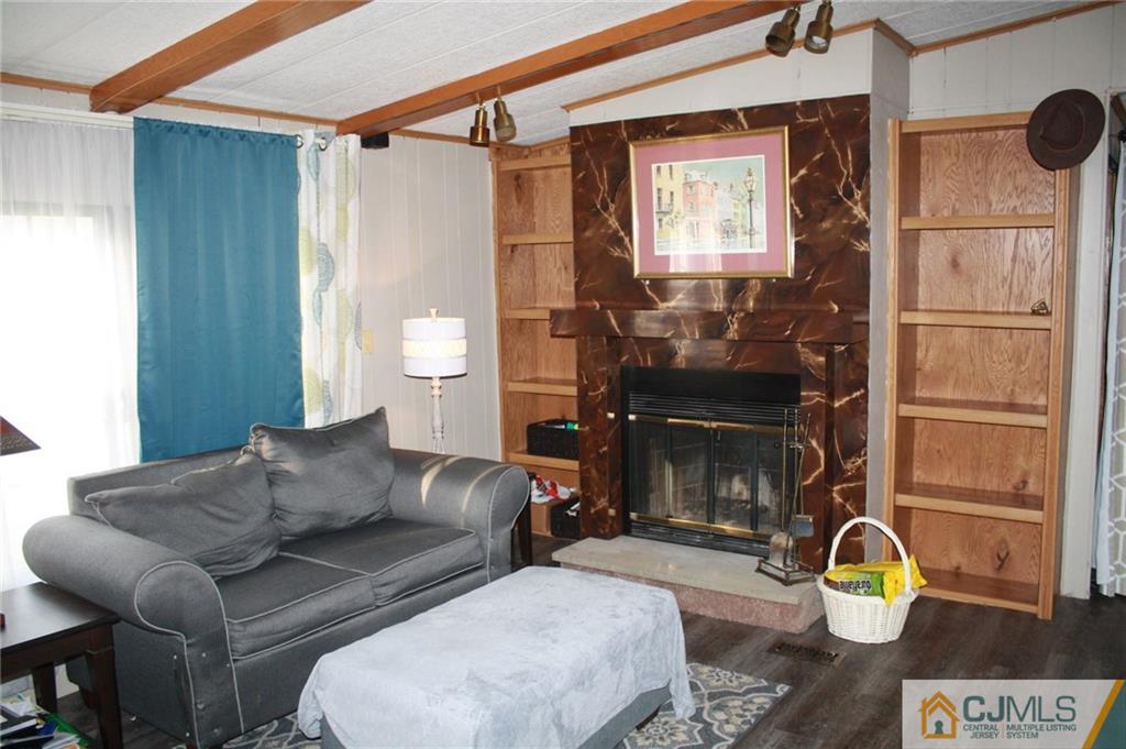 2 Hugo Road North Brunswick, NJ 08902 - Photo 11 of 14 a living room with furniture and a fireplace