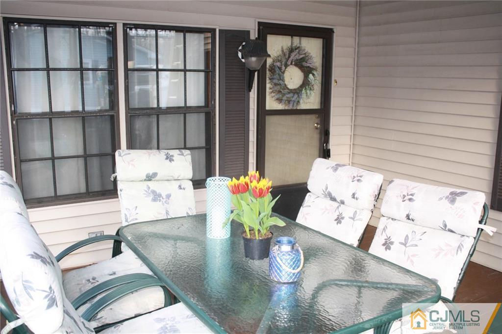2 Hugo Road North Brunswick, NJ 08902 - Photo 5 of 14 a view of a dining room with furniture and wooden floor