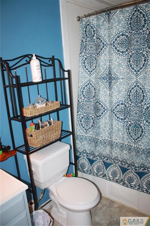 2 Hugo Road North Brunswick, NJ 08902 - Photo 9 of 14 a bathroom with a toilet and a mirror