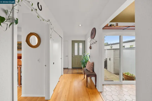 a view of entryway with wooden floor