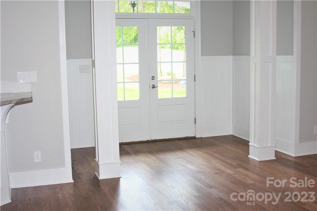 651 Bellegray Road Clover, SC 29710 - Photo 5 of 39 an empty room with wooden floor and windows