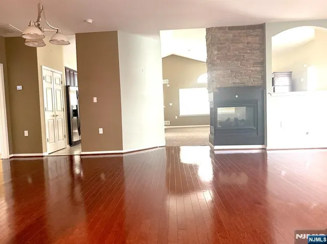 a kitchen with stainless steel appliances granite countertop a refrigerator sink and cabinets