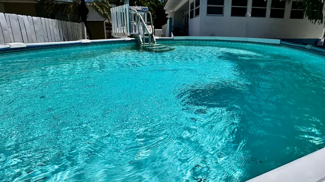 a view of a wooden deck and a yard in the back
