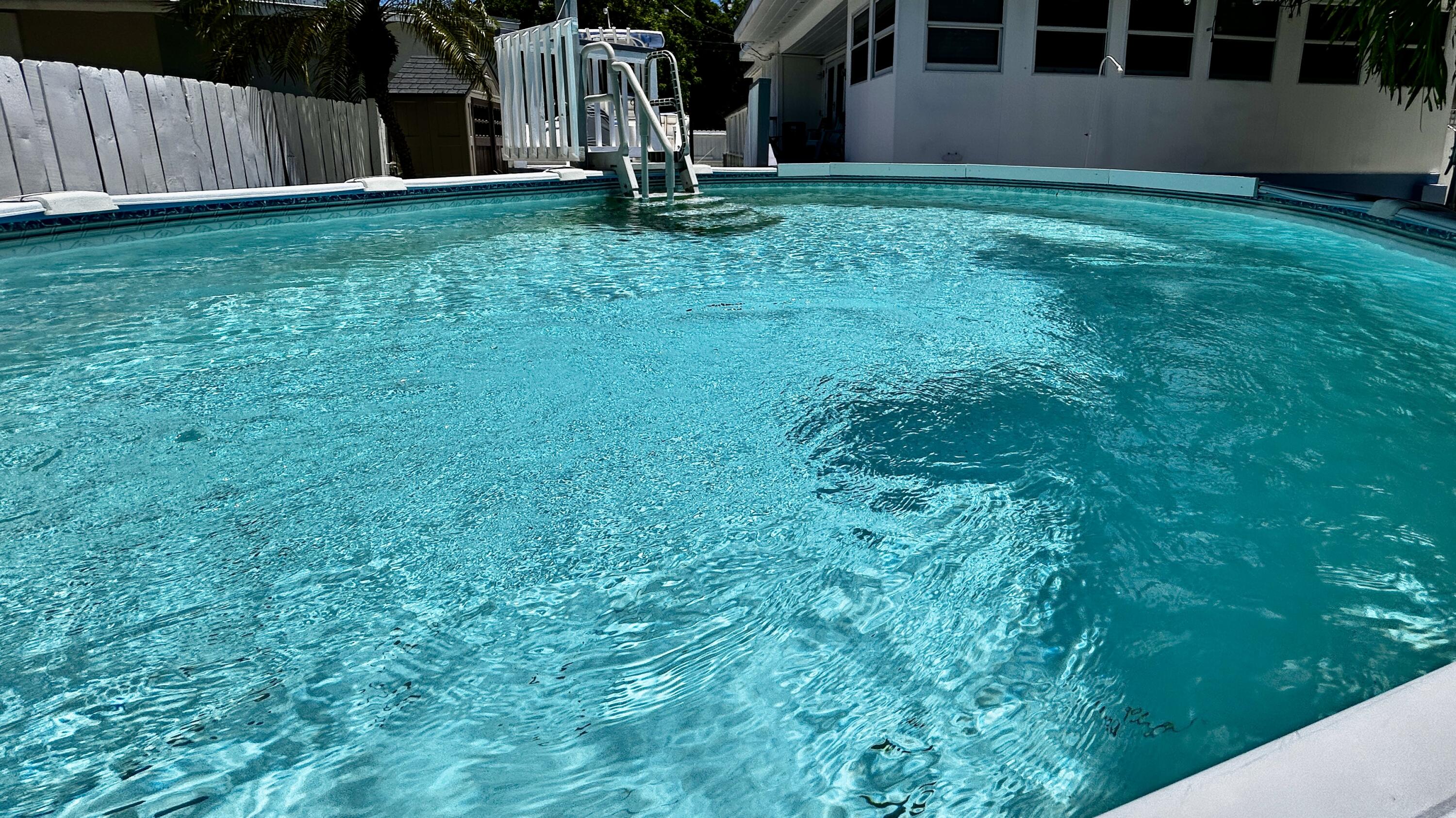 124 South Bay Harbor Drive Key Largo, FL 33037 - Photo 12 of 43 a view of an house with backyard space and garden