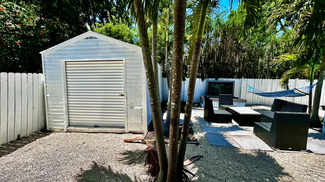 a spacious bedroom with a bed and a window