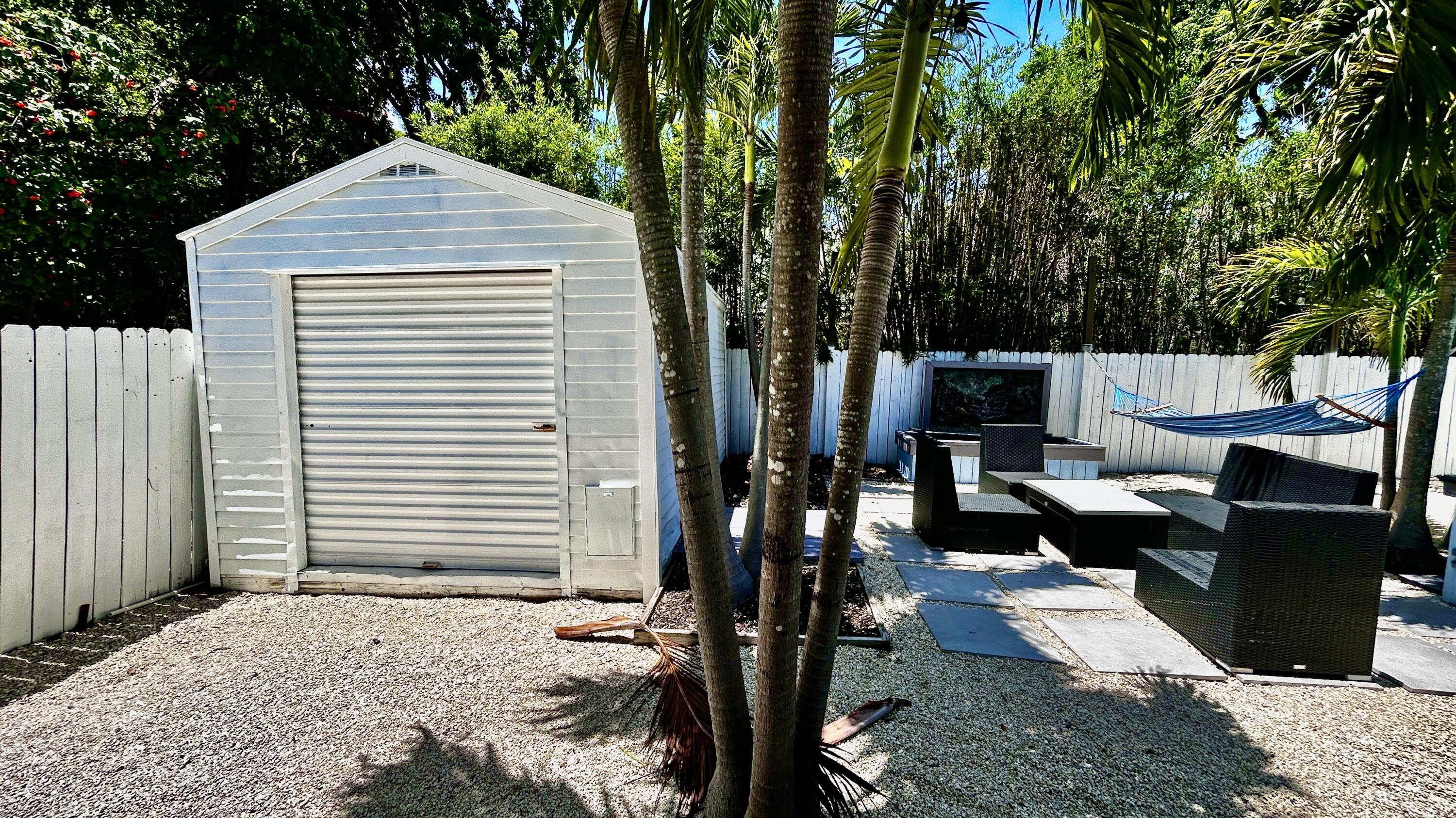 124 South Bay Harbor Drive Key Largo, FL 33037 - Photo 14 of 43 a view of backyard of the house